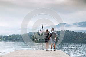 Young couple of tourists in love on the Lake Bled, Slovenia.