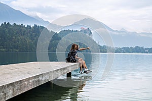 Young couple of tourists in love on the Lake Bled, Slovenia.