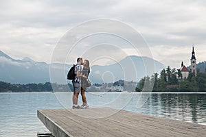 Young couple of tourists in love on the Lake Bled, Slovenia.