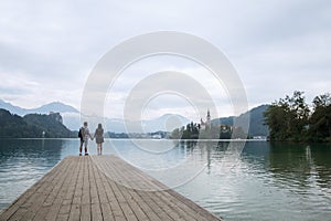 Young couple of tourists in love on the Lake Bled, Slovenia.