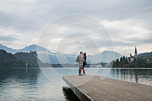 Young couple of tourists in love on the Lake Bled, Slovenia.