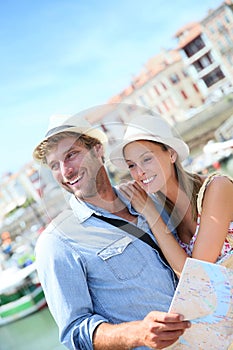 Young couple of tourists on seaside