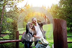 Young couple traveling in a nature. Happy people. Travel lifestyle