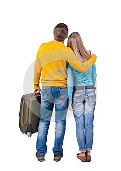 Young couple traveling with suitcas