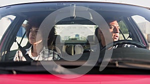 Young couple travelling by car together. Slow motion