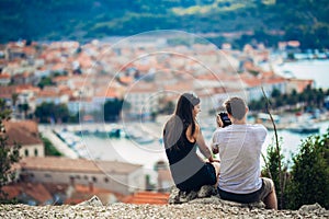 Young couple travelling and visiting Europe.Summer touring Europe and Mediterranean culture.Colourful streets,cityscape