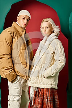 young couple in trendy winter jackets