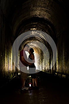 Young couple in a tunnel