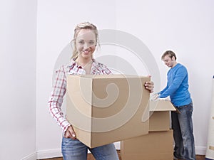 Young couple unpacking boxes