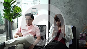 The young couple used smartphone in cafe shop