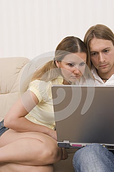 Young couple using computer