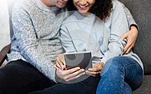 Young Couple using digital tablet