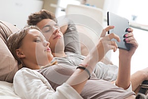 Young couple using digital tablet