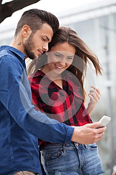 Young couple using smart phone