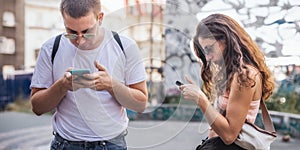 Young couple using smartphones. Emotional isolation and technology depresion photo