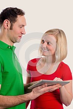 Young couple using tablet pc