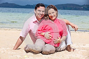 Young couple waiting for their baby at the beautiful white beach of Lake Tota located in the department of Boyaca at 3,015 meters