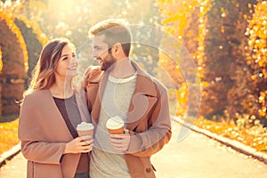 Young couple walk in the autumn park