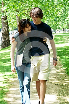 Young couple walking in park