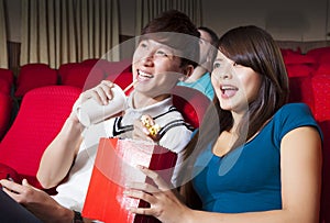 Young couple watching a movie