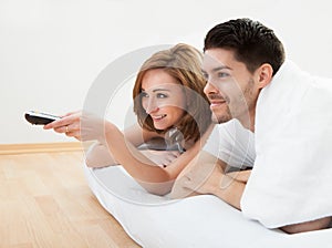 Young couple watching television