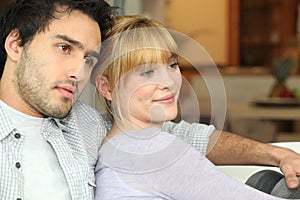 Young couple watching TV