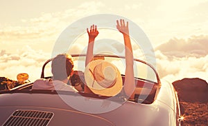 Young Couple Wathcing the Sunset in Vintage Sports Car