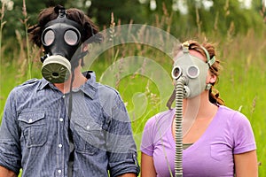 Young Couple Wearing Gas Masks