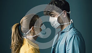 Young couple wearing a protective face mask