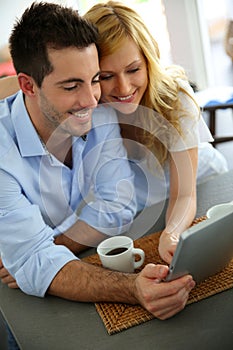 Young couple websurfing on internet photo