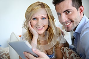 Young couple websurfing on internet photo