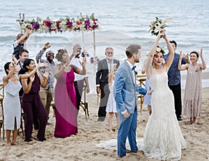 Young couple in a wedding ceremony at the beach