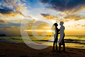 Young couple on wedding day on tropical beach and sunset