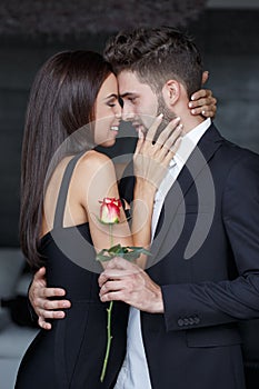 Young couple whispering love to each other on dating