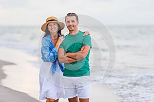 Young couple on white beach during summer vacation.