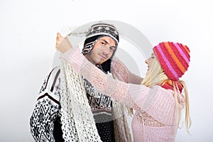 Young couple in winter clothes having fun