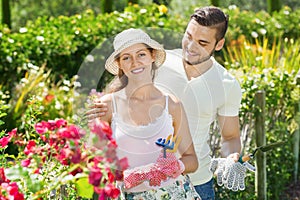 Young couple working in garden