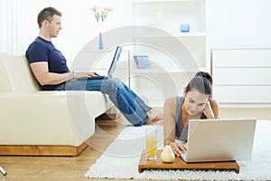 Young couple working at home