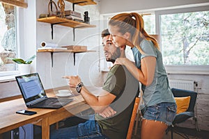 Young couple working on laptop