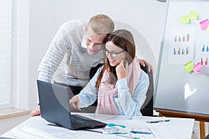 Young couple working in office