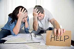 Young couple worried at home in bad financial situation stress asking for help