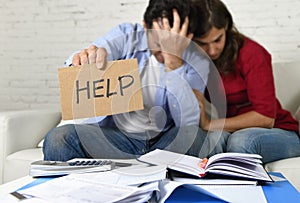 Young couple worried at home in bad financial situation stress asking for help