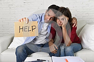 Young couple worried at home in bad financial situation stress asking for help