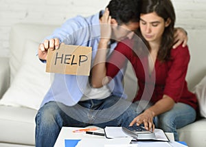 Young couple worried at home in bad financial situation stress asking for help