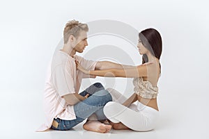 Young couple in yoga pose photo