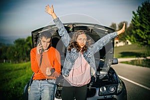Young couples car broke down on the way. They hitchhike to find help