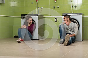 Young Couples Doing Housework Laundry