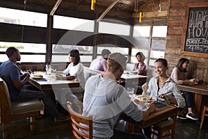 Young couples eating lunch relax in a restaurant