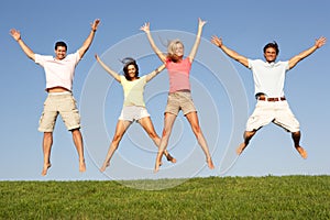 Young couples jumping in air