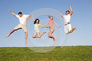 Young couples jumping in air